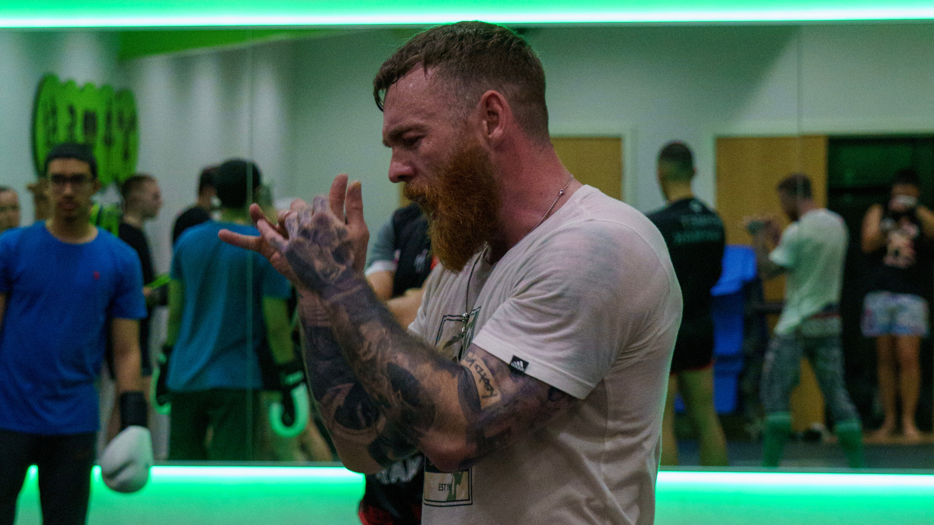 Jake Bingham wrapping his hands before a coaching session