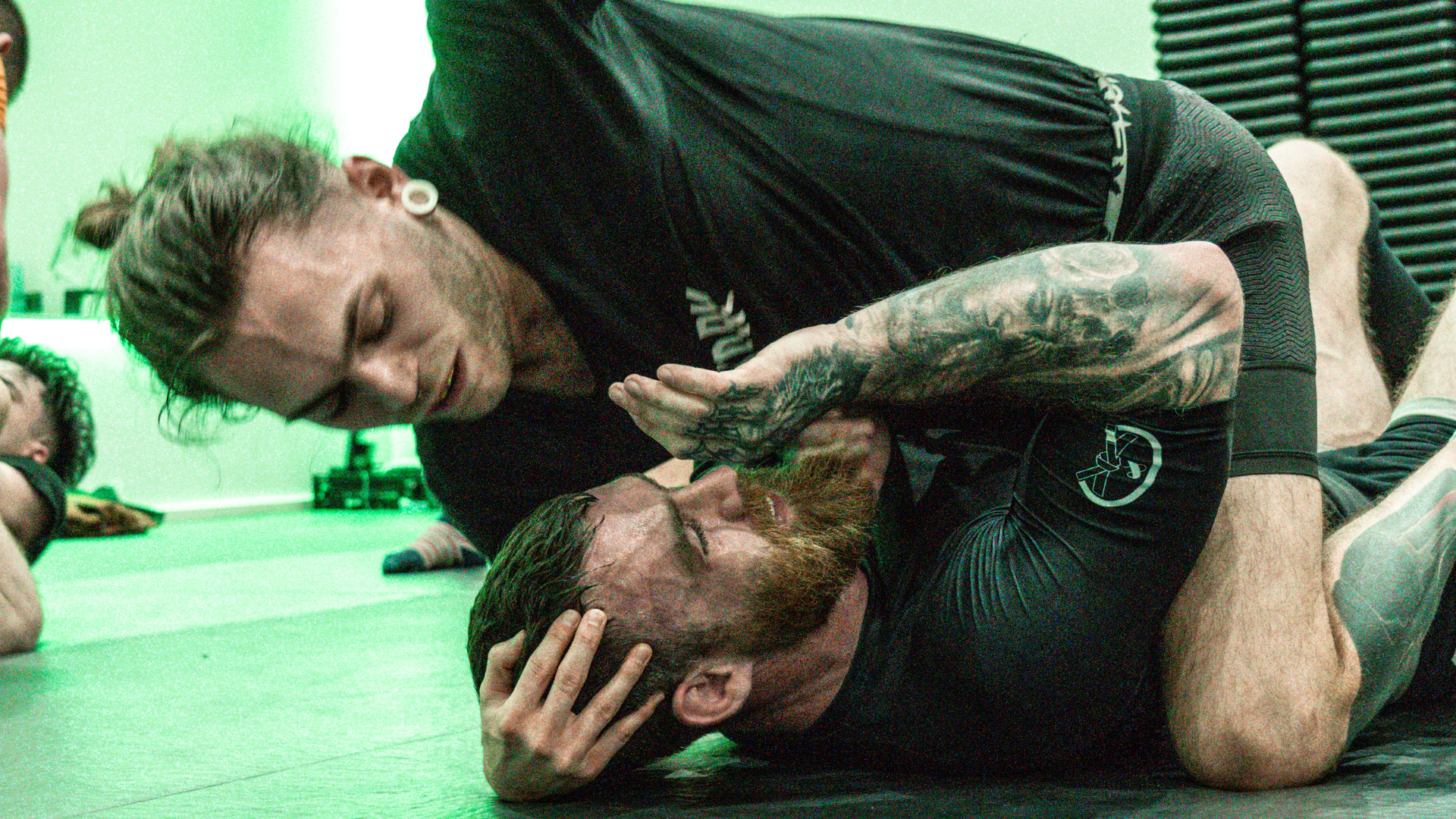 Jake Bingham grappling on the mat