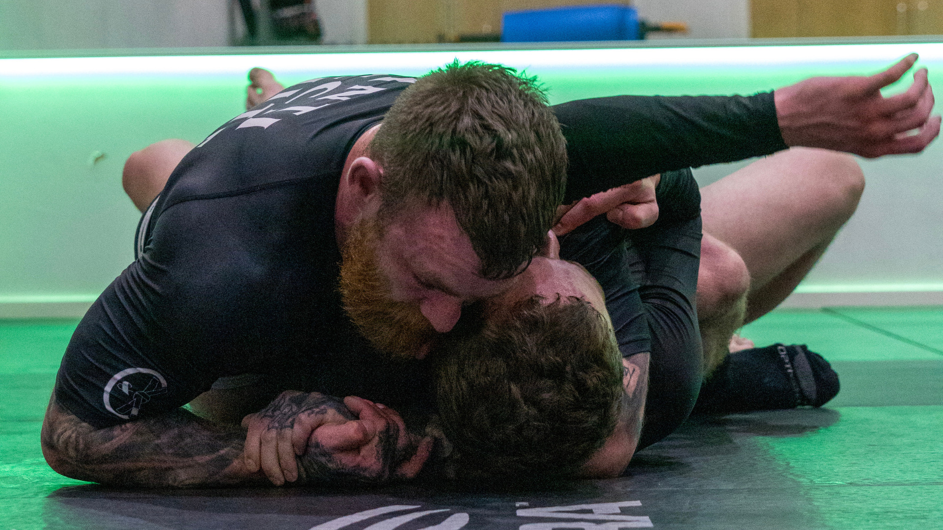 Jake Bingham in a grappling exchange on the mat